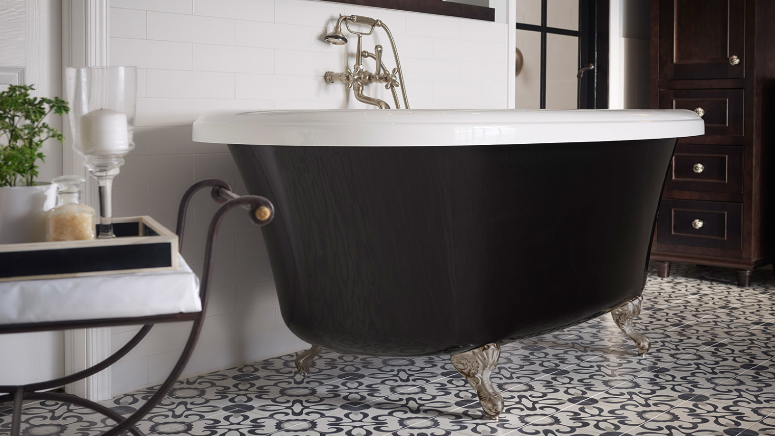 Image of a free standing tub with legs and a dark design.