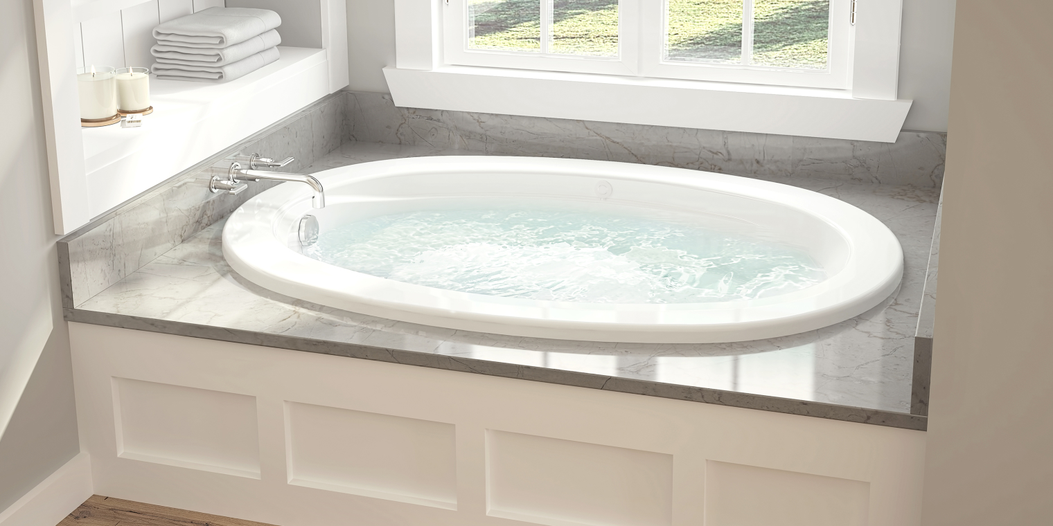 Drop in tub with a jetted system with marble platform.