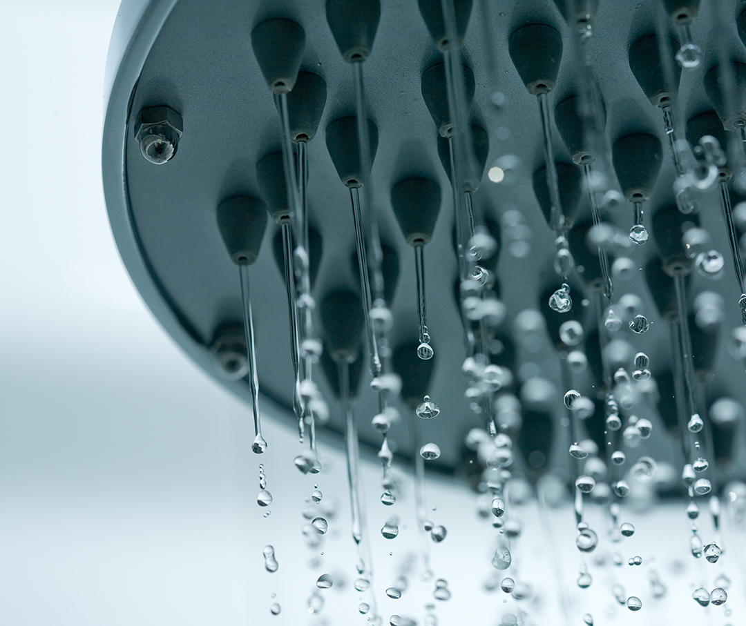 Shower head spraying out water.