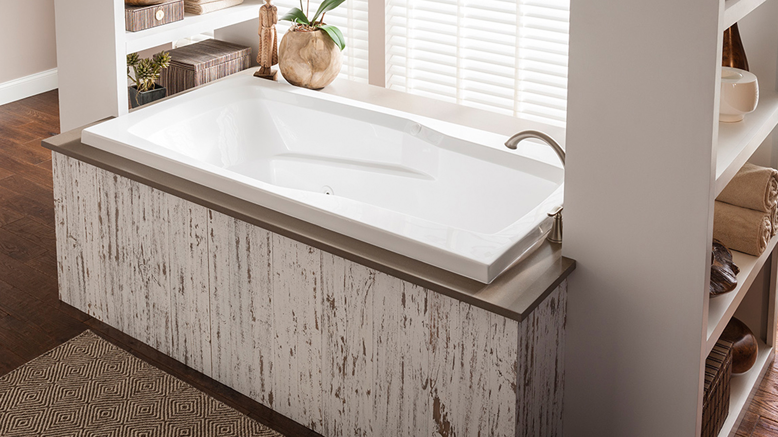 Image of a tub with jetted system and wooden platform.