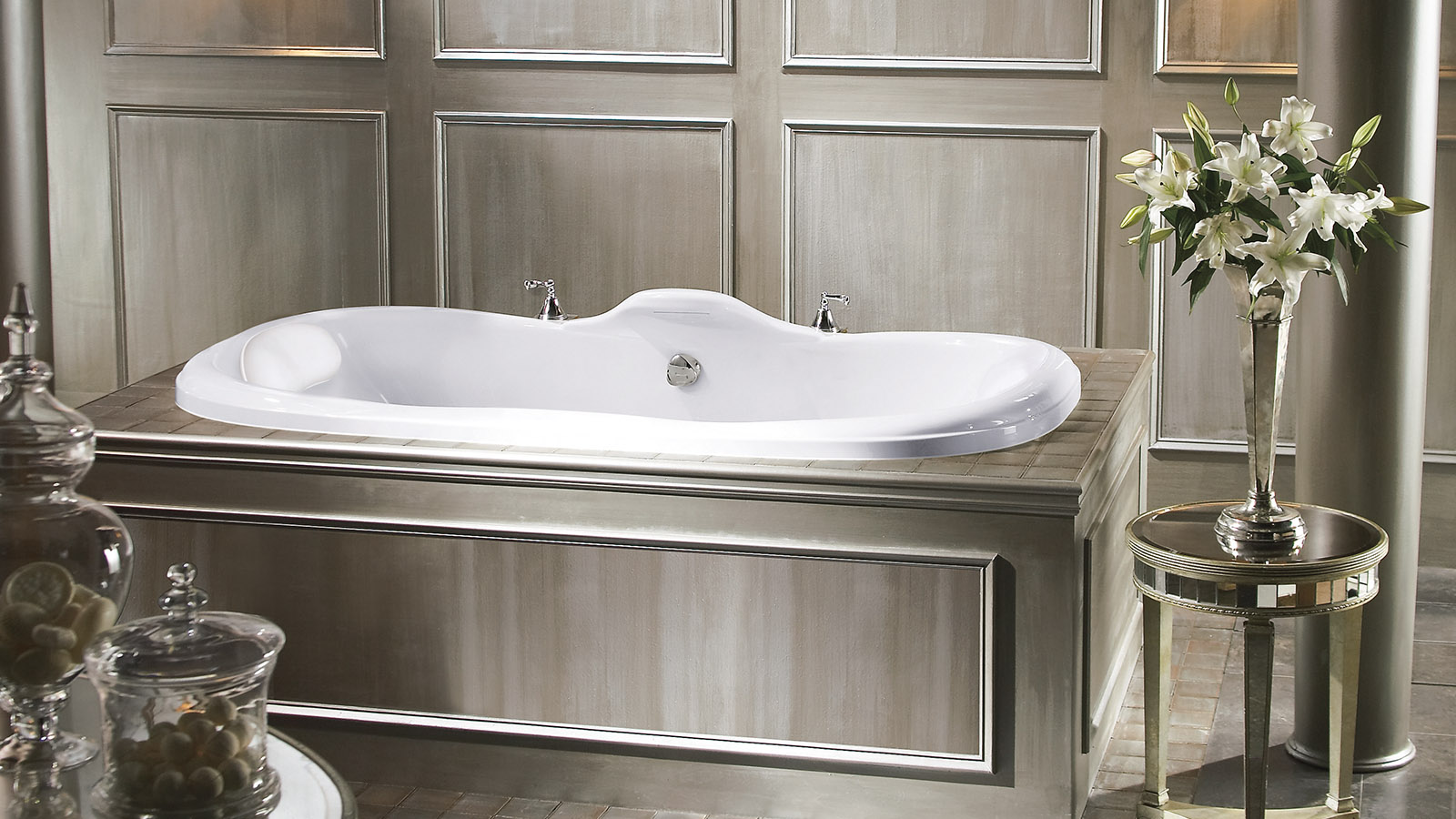 Image of a soaker tub skirted by a wooden platform.